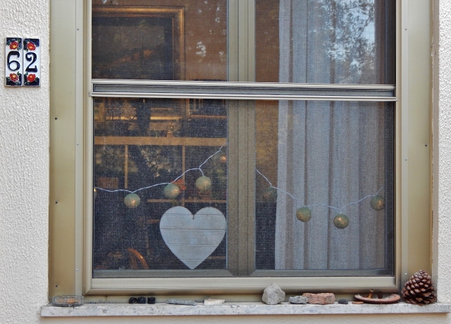 The outside view. The heart on my windowsill adorned with the lights from Thailand by sis.